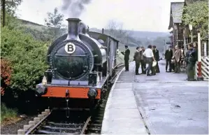  ?? GAVIN MORRISON ?? During one of its first outings on the Keighley & Worth Valley Railway, No. 752 pauses in Haworth station with a GWR ‘Toad’ brake van on June 3 1972.