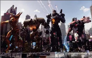  ?? Legendary Pictures/Universal Pictures ?? Giant robots, known as Jaegers, must defend the world from monsters from another dimension in “Pacific Rim: Uprising.” From left, Saber Athena, Bracer Phoenix, Gipsy Avenger and Guardian Bravo.