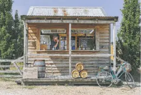  ??  ?? Drinks are sold at a roadside stall at the Shene Distillery in Tasmania, where gin makers are creating a name for themselves.