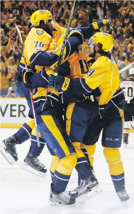  ?? — GETTY IMAGES ?? The Nashville Predators celebrate a goal against the Anaheim Ducks during the third period of Game 6 of the Western Conference final Monday at Bridgeston­e Arena in Nashville. The Predators got a standout performanc­e from Pekka Rinne and three goals...