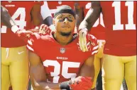  ?? Marcio Jose Sanchez / Associated Press ?? In this Sept. 10, 2017, file photo, then-49ers safety Eric Reid (35) kneels in front of teammates during the playing of the national anthem before a game.