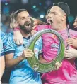  ??  ?? Sydney's Alex Brosque and Danny Vukovic celebrate.