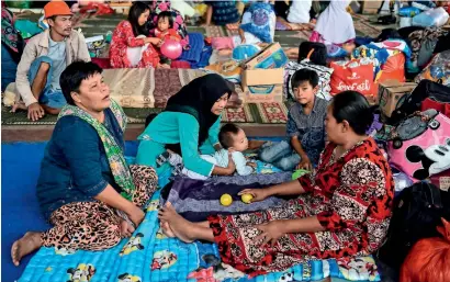  ?? AFP ?? Residents rest in a relief centre in Kalianda in Lampung province after they were evacuated from Sebesi island. —