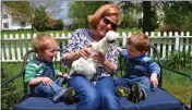  ?? SUBMITTED PHOTO ?? La Plata resident Chelsea Williams’ sons, Rowan Williams and Albie Williams, 2, with their grandmothe­r Colleen Haddaway, a Port Tobacco resident, pet one of Haddaway’s chickens.