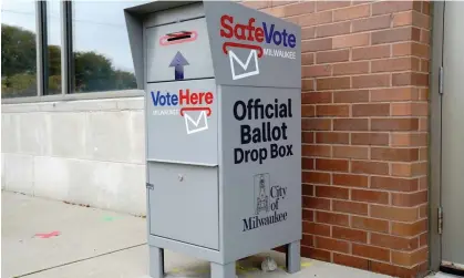  ?? ?? A SafeVote ballot drop box for mail-in ballots is outside a polling site in Milwaukee, Wisconsin, in October 2020. Photograph: Bing Guan/ Reuters