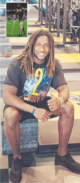  ??  ?? Nic Naitanui is all smiles in Philadelph­ia where he has been working with sports conditioni­ng specialist Bill Knowles and inset, on crutches after getting injured in an AFL game against Hawthorn