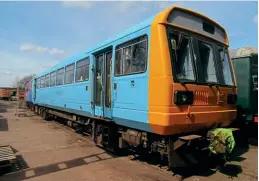  ?? Andy Coward ?? –
Midway through its retro repaint into Provincial blue, 142011 stands outside the Midland Railway – Butterley’s DMU restoratio­n shed on April 10. Work on the revival of the unit, which was originally destined to be scrapped after being stripped of spares, is at an advanced stage and it is intended that it will enter service at the MRB’S DMU gala on June 18/19.