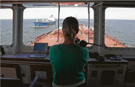  ?? James Nielsen / Staff file photo ?? A captain pilots an oil tanker through the Houston Ship Channel last year. “The Houston Ship Channel is a unique and particular­ly challengin­g waterway,” the Houston Pilots wrote in its applicatio­n to increase rates.