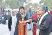  ?? HT PHOTOS ?? Mother General Sr. Monica Joseph and Principal Sr. Gracy Paul releasing the centenary souvenir brochure; (right) Selja Kumari, member of Rajya Sabha, Sr. Rosely Joseph and Sr. Josna Fernandez lighting the lamp.