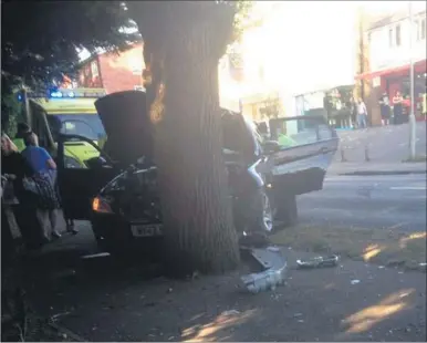  ??  ?? A BMW crashed into a tree at the Nettlefiel­d junction in Faversham Road, Ashford, on Saturday after it was struck by a silver MG being chased by police