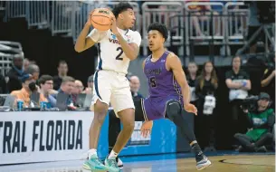  ?? FILE ?? Shown in an NCAA Tournament loss to Furman, Virginia guard Reece Beekman, a 6-3 senior guard and a preseason first-team All-ACC selection, had a chance to turn pro after last season. He attended the NBA draft combine, then decided to return to Charlottes­ville.