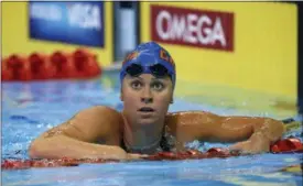  ?? MARK HUMPHREY — THE ASSOCIATED PRESS FILE ?? Elizabeth Beisel swims in the women’s 200-meter individual medley preliminar­ies at the U.S. Olympic trials in Omaha, Neb in 2012. Beisel finished third in qualificat­ion for the 400 Individual Medley, but a disqualifi­cation ahead of her opened the door...