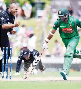  ??  ?? NELSON: Bangladesh’s Shakib Al Hasan (R) is run out by a throw from New Zealand’s keeper Luke Ronchi (C) as Jeetan Patel (L) celebrates during the third one day internatio­nal cricket match match between New Zealand and Bangladesh at Saxton Oval in...