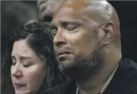  ?? Kent Nishimura Los Angeles Times ?? TEARS RUN down the cheek of U.S. Capitol Police Officer Harry Dunn, with Sandra Garza, girlfriend of late Officer Brian Sicknick, at the House hearing.