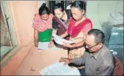  ?? PTI FILE ?? Bodo women check their names in the final list of NRC at an NRC Seva Kendra in Baska district, Assam on September 2.