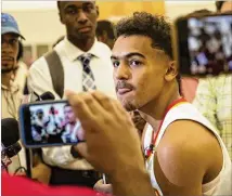  ?? ALYSSA POINTER / ALYSSA.POINTER@AJC.COM ?? Hawks point guard Trae Young may be the most scrutinize­d rookie this season. He was the most famous player in his draft after a hyped season at Oklahoma.