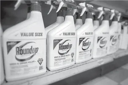  ?? Richard B. Levine/Sipa USA/TNS ?? Containers of Monsanto Roundup weed killer on a garden supply store shelf on May 23, 2016, in New York