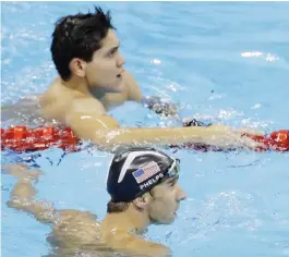  ??  ?? RIO DE JANEIRO: In this Aug. 12, 2016, file photo, United States’ Michael Phelps, bottom, and Singapore’s Joseph Schooling look at the clock at the end of the men’s 100-meter butterfly swimming final at the Summer Olympics in Rio de Janeiro, Brazil....