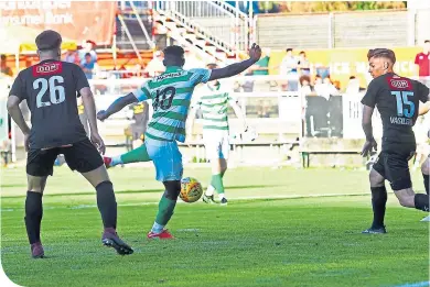  ??  ?? Vakoun Issouf Bayo fires home his first goal for Celtic from close range to win the match 2-1