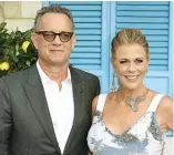  ?? ANTHONY HARVEY/AFP ?? DI AUSTRALIA: Tom Hanks dan istrinya, Rita Wilson, mengumumka­n terkena korona kemarin pagi.