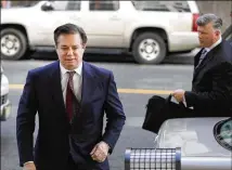  ?? AARON P. BERNSTEIN/ ?? Paul Manafort (left), former campaign manager for Donald Trump, arrives Friday at federal court in Washington. A U.S. district court judge said sending Manafort to a jail cell was “an extraordin­arily difficult decision.”