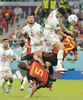  ?? ALESSANDRA TARANTINO/AP ?? Nayef Aguerd heads the ball during Morocco’s win against Belgium at the World Cup on Sunday.