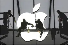  ??  ?? Workers prepare for the opening of an Apple store in Hangzhou, Zhejiang province, China. — Reuters photo