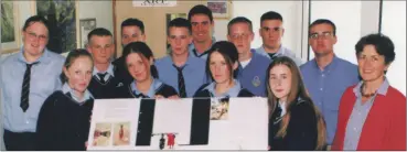  ?? ?? Teacher Rory O’Connor with transition year students at Coláiste an Chraoibhín, Fermoy who organised a No Uniform Day, to assist the orphans of Malawi. On the right of picture is Maggie Blackley who addressed the students on the crisis in Malawi at that time.