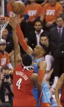  ?? AP photo ?? Russell Westbrook of the Thunder shoots over the Blazers’ Maurice Harkless on Friday.
