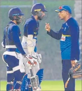  ?? AFP ?? Sri Lanka batting coach Thilan Samaraweer­a (right) has a chat with Upul Tharanga (centre) and Kusal Mendis during a training session in Dubai ahead of their match against Bangladesh.