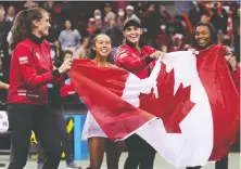  ?? THE CANADIAN PRESS ?? Canada's Rebecca Marino, from left to right, Leylah Fernandez, captain Heidi El Tabakh and Francoise Abanda celebrate after Fernandez's win at the Billie Jean King Cup qualifier at the Pacific Coliseum on Saturday.