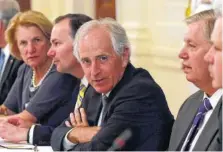  ?? ASSOCIATED PRESS FILE PHOTO ?? Sen. Bob Corker, R-Tenn., center, waits for President Donald Trump to join a meeting of Republican senators on health care in the East Room of the White House in Washington in June.