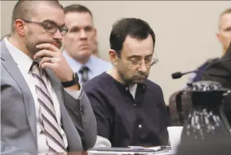  ?? Carlos Osorio / Associated Press ?? Before serving the Michigan prison term, Larry Nassar must first serve a 60-year sentence for child pornograph­y crimes. He could complete that sentence in about 55 years.