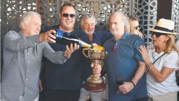  ?? ?? Twilight Payment’s owners (from left) Gerry
Ryan, Nick Williams, Vin Sammartino, the late Michael Gudinski and his wife Sue celebrate their 2020 Cup victory. Picture: Josie Hayden