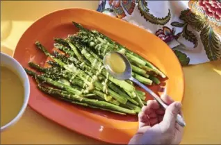  ?? MIA, THE ASSOCIATED PRESS ?? This lemon sauce is a simple way to dress up roasted asparagus, the pinup vegetable of spring.