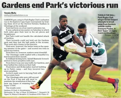  ?? Picture: EUGENE COETZEE ?? TUSSLE FOR BALL: Park Rugby Club winger Kirwin Delport attempts to break away from Gardens outside centre Duwayne Paulse, in their Super 12 rugby match in Uitenhage