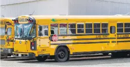  ?? DARREN STONE, TIMES COLONIST ?? School District No. 63 (Saanich) buses at the district yard on Keating Cross Road.