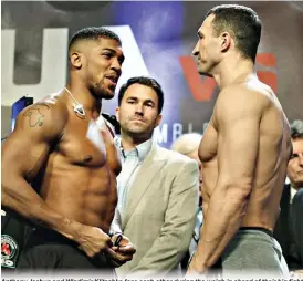  ??  ?? Anthony Joshua and Wladimir Klitschko face each other during the weigh in ahead of their big fight at Wembley Arena in London today