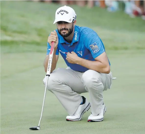  ?? — GETTY IMAGES FILES ?? Adam Hadwin, shown lining up a putt during the third round of play on Saturday, saw his game get back on track last weekend at the World Golf Championsh­ips-Bridgeston­e Invitation­al in Akron, Ohio.