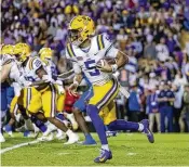  ?? DERICK HINGLE / AP ?? LSU quarterbac­k Jayden Daniels figures to go in the top three at this week’s NFL draft. The 2023 Heisman Trophy winner could be an ideal fit for new Washington offensive coordinato­r Kliff Kingsbury, who had some success with dual-threat QB Kyler Murray in Arizona.