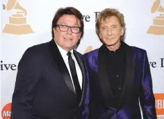  ??  ?? SINGER Barry Manilow (R) and his manager Garry Kief at the 2016 Pre-GRAMMY Gala and Salute to Industry Icons on Feb. 13, 2016, at The Beverly Hilton Hotel in California.