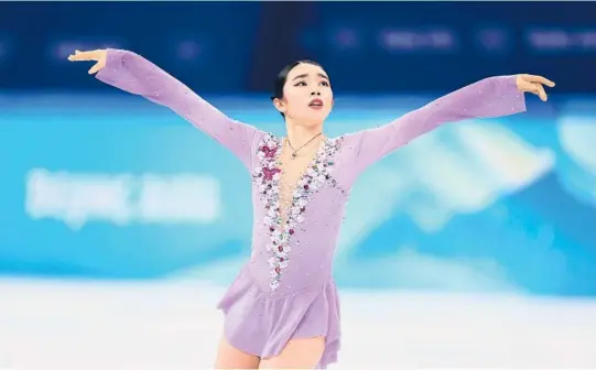  ?? MATTHEW STOCKMAN/GETTY ?? US figure skater Karen Chen competes in the women’s free skate program Thursday in Beijing. A week earlier she helped the U.S. mixed team win a silver medal.