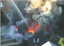  ?? WCVB 2018 ?? An image from video shows flames consuming a home last September following a blast in Lawrence, Mass. The explosions and fires in the Merrimack Valley destroyed more than 100 buildings.