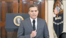  ?? Evan Vucci/Associated Press ?? CNN journalist Jim Acosta reports Wednesday before a news conference with President Donald Trump in the East Room of the White House.