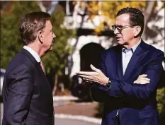  ?? Associated Press ?? Then-Gov. Dannel P. Malloy, right, talks with Connecticu­t's governor-elect Ned Lamont at the governor's residence in 2018.