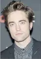  ?? Jamie McCarthy Getty Images ?? “TWILIGHT” heartthrob Robert Pattinson loves Safdie Bros.’ style.