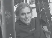  ?? ALDEN PELLETT/AP ?? Jake Burton, owner of Burton Snowboards who died in 2019, displays snowboard models in 2002.