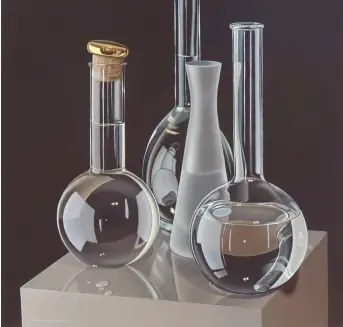  ??  ?? p Glassware II, acrylic on canvas, 15¾315¾in (40340cm).
‘The symmetrica­l, triangular compositio­n is slightly unusual for me. The round grappa bottle is one of my favourite still-life objects. I liked the repeated spherical shapes and the contrast between the glossy and frosted glass. Filling the bottles with water seemed to emphasise their roundness – I exaggerate­d the reflection­s on the glossy plinth. The group was lit from the front with a warm electric light, and from the right with a large LED light box.
‘There is a bright red base under the dark warm grey background colour, which was applied in several thin washes so that the red shone through very slightly. I darkened the tone of the plinth a little to allow the highlights on the bottles to shine. I was quite pleased with the small colour accent of the grappa bottle top and its jaunty angle which, along with the slight angle of the plinth, softened the rather austere arrangemen­t. The liquid drops were glycerine because water dries too quickly and doesn’t bead up so much.’