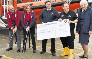  ??  ?? From left, Bruce Maguire, Fran Fearn, Mark Laming (RNLI chief executive fundraiser), Neil (tractor driver), and Diane Randall (fundraiser)