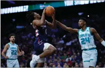  ?? (AP Photo/ Matt Slocum) ?? Philadelph­ia 76ers’ Tyrese Maxey, center, goes up for a shot against Charlotte Hornets’ Brandon Miller during the first half of an NBA basketball game, Saturday, March 16, 2024, in Philadelph­ia.